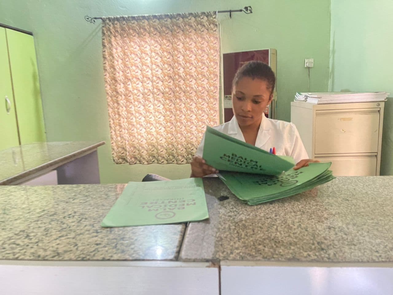 Friendly receptionist at Balm Medical Center
